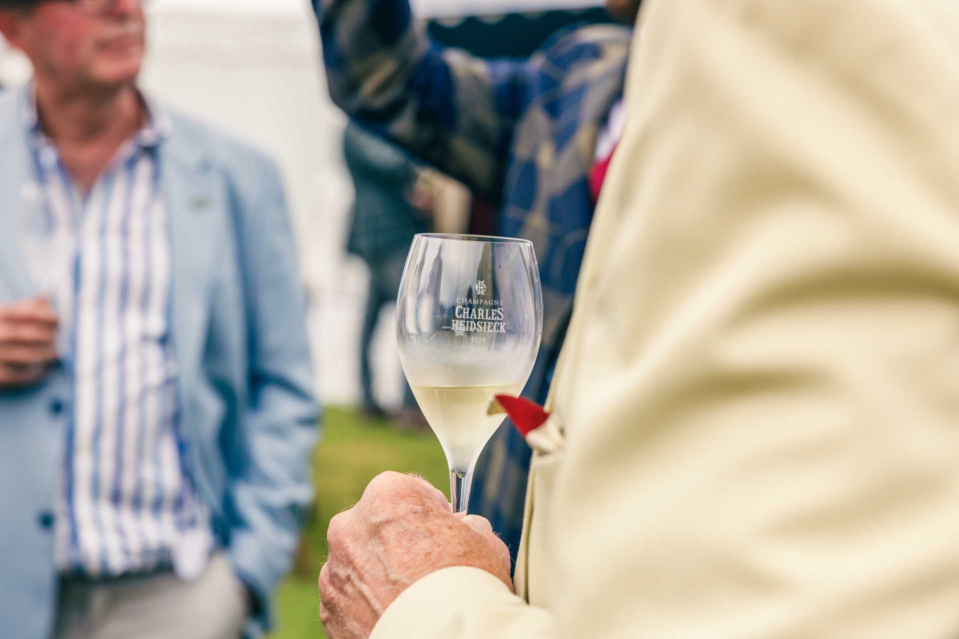 Enjoying Champagne at Concours of Elegance