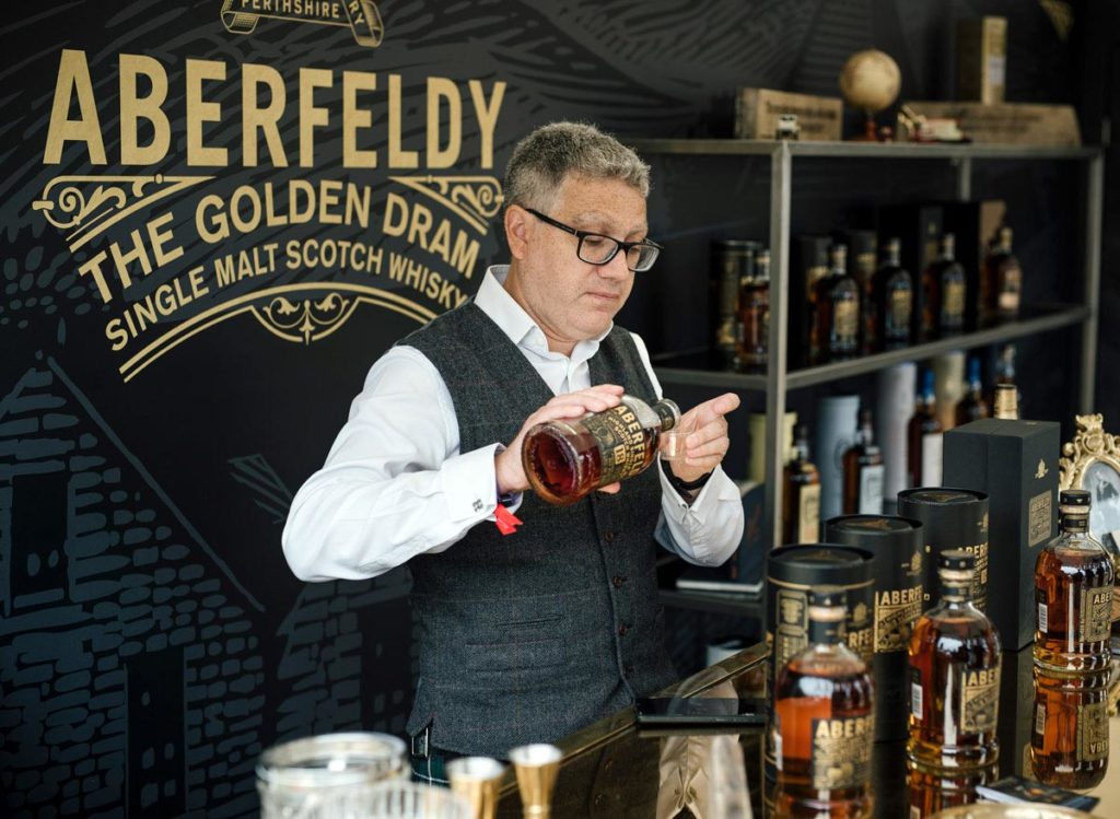 Pouring John Dewars Aberfeldy Whisky